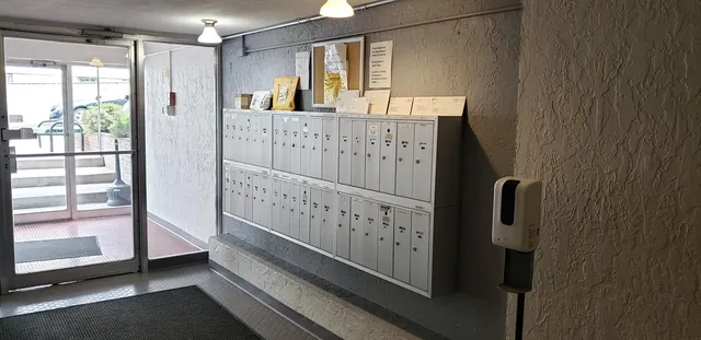a kitchen with a refrigerator and cabinets