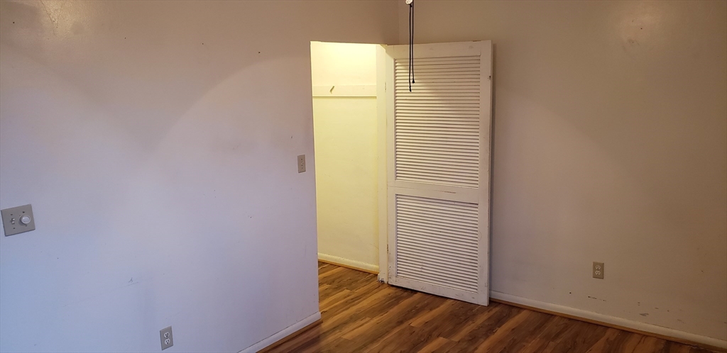 6 Hayes Road, Unit 25 Boston, MA 02131 - Photo 4 of 39 a view of a room with wooden floor