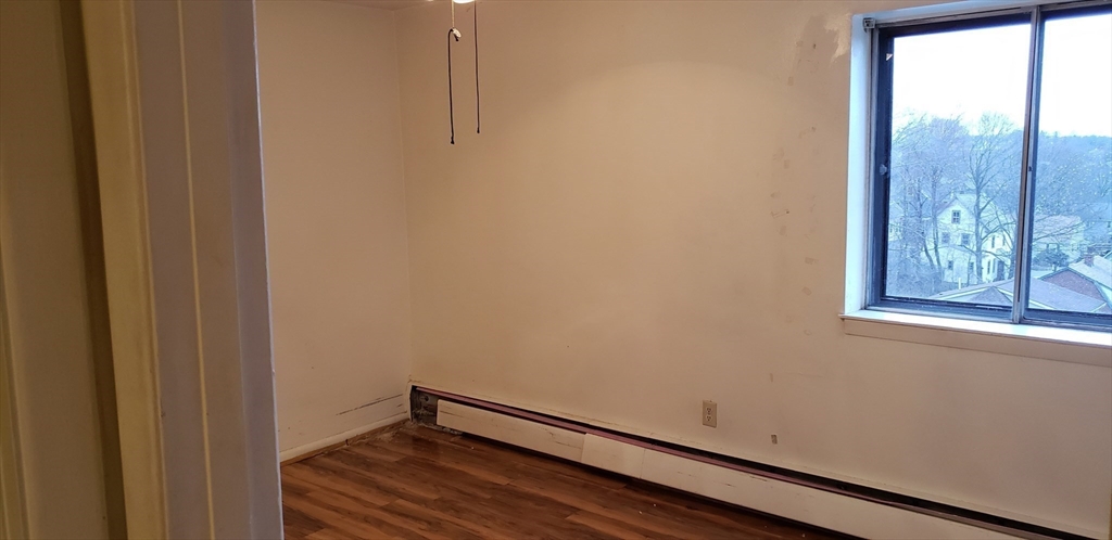 6 Hayes Road, Unit 25 Boston, MA 02131 - Photo 6 of 39 a view of a room with wooden floor and windows