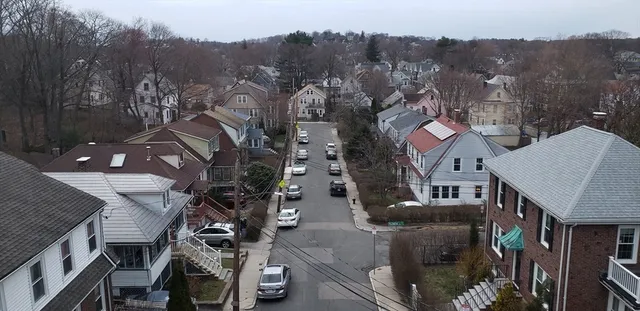 an aerial view of a house with a mountain view