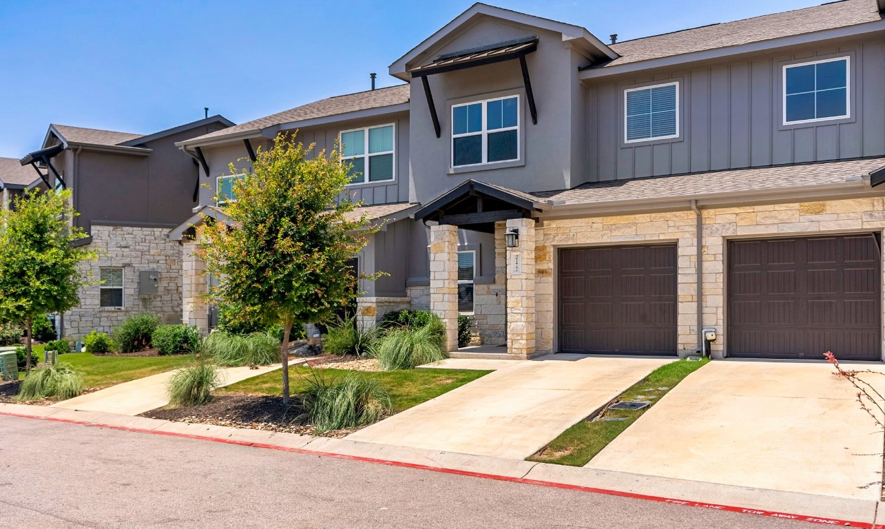 2177 Local Rebel Loop Leander, TX 78641 - Photo 1 of 1 a front view of a house with a yard and garage