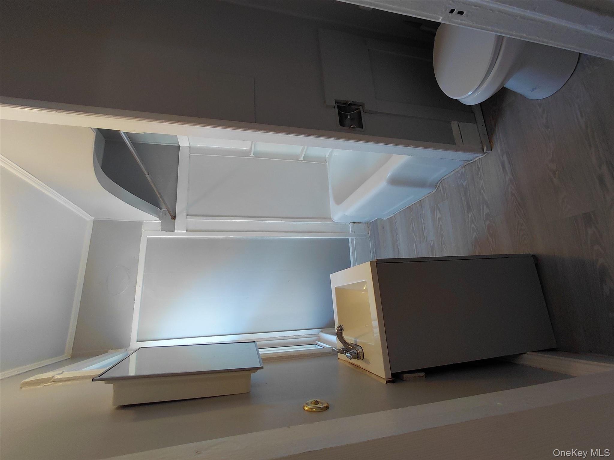 67 Greenkill Avenue, Unit A2 Kingston, NY 12401 - Photo 11 of 13 Bathroom featuring vanity, dark wood-style flooring, ornamental molding, and shower / tub combination