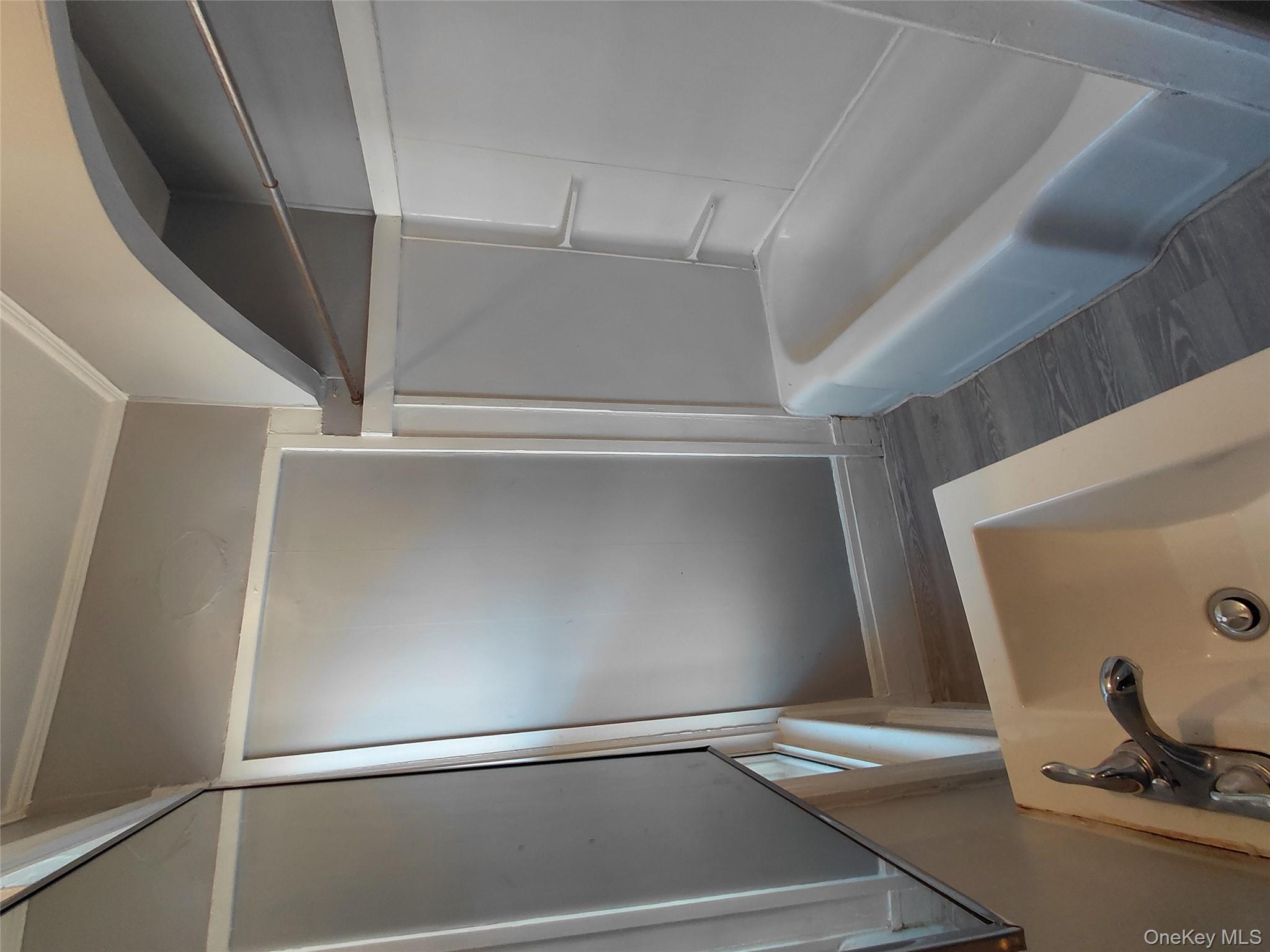 67 Greenkill Avenue, Unit A2 Kingston, NY 12401 - Photo 12 of 13 Bathroom featuring crown molding, dark wood-style flooring, and shower / bathtub combination