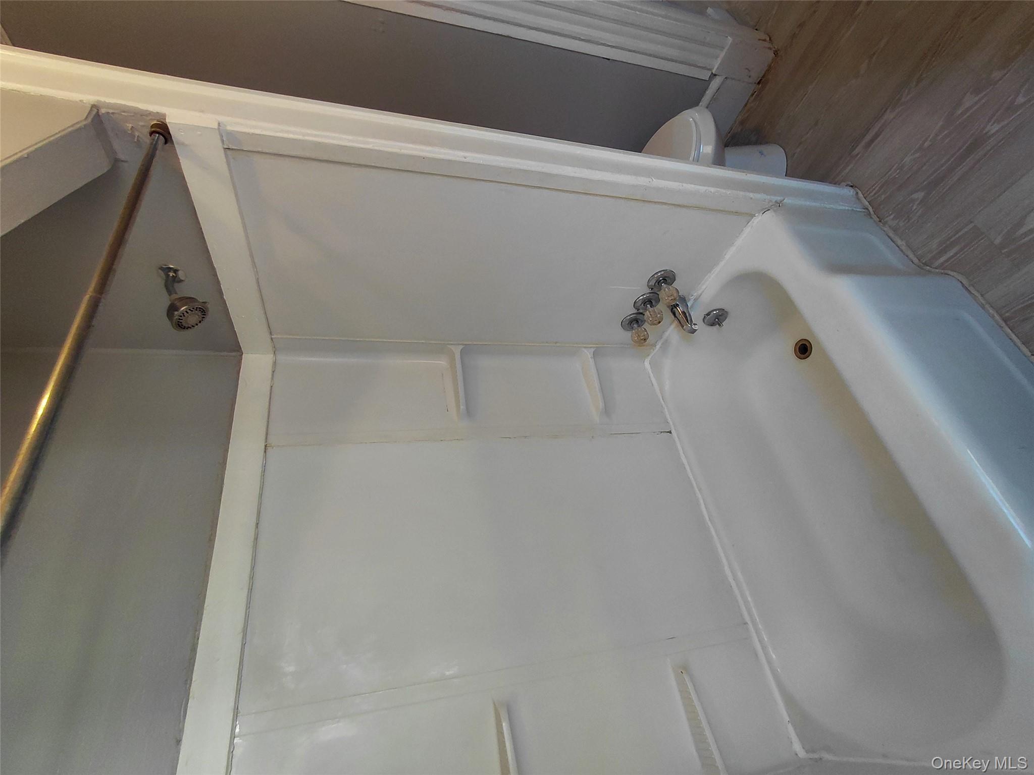 67 Greenkill Avenue, Unit A2 Kingston, NY 12401 - Photo 13 of 13 Full bath with bathing tub / shower combination and wood finished floors