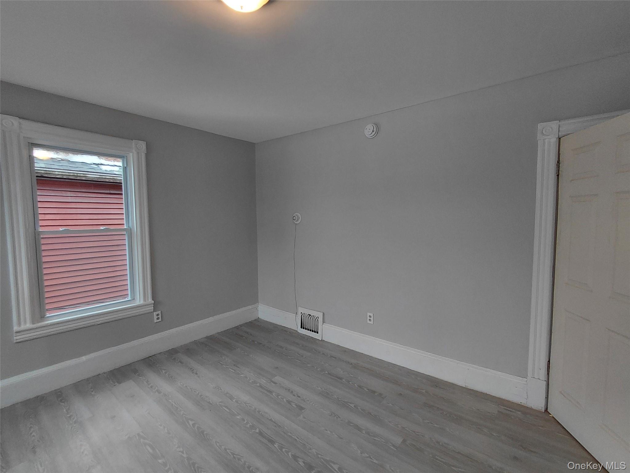 67 Greenkill Avenue, Unit A2 Kingston, NY 12401 - Photo 5 of 13 Empty room with baseboards and light wood-style floors