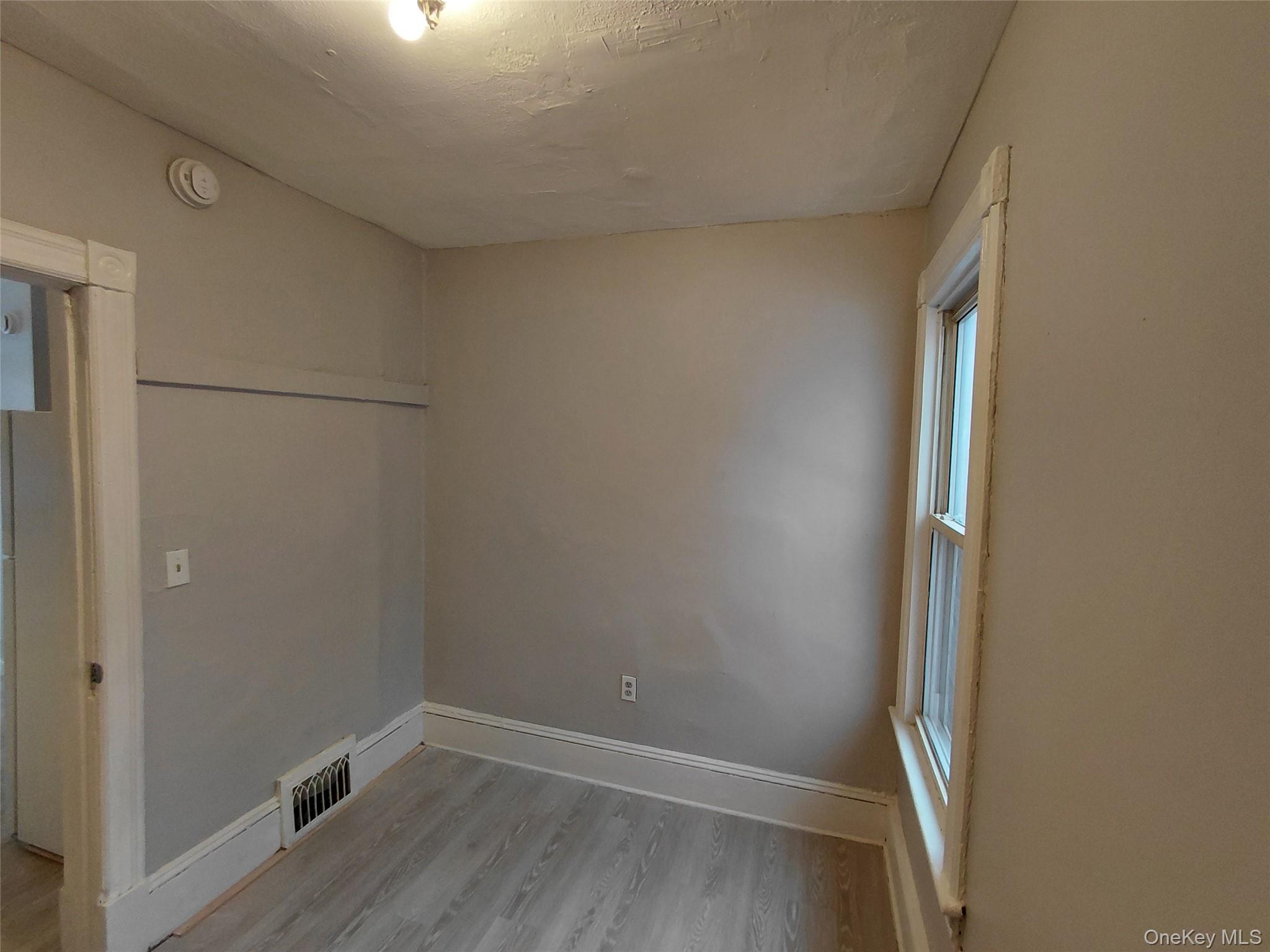 67 Greenkill Avenue, Unit A2 Kingston, NY 12401 - Photo 10 of 13 Spare room featuring light wood-type flooring and baseboards