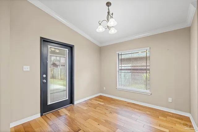 a view of empty room with an entryway