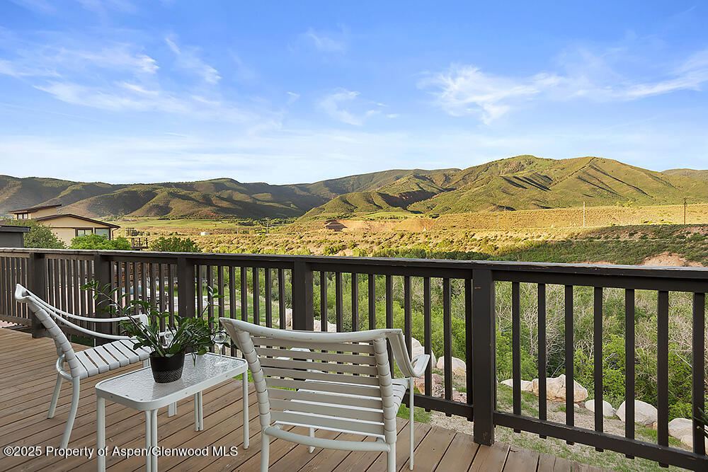 a view of a chairs and table on the terrace