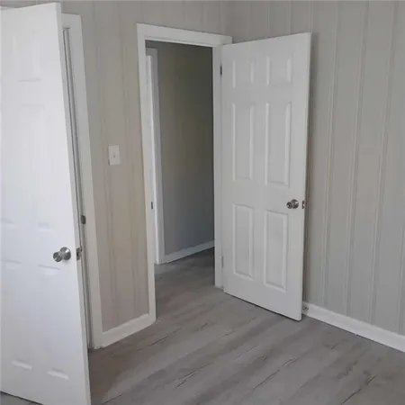 an empty room with wooden floor