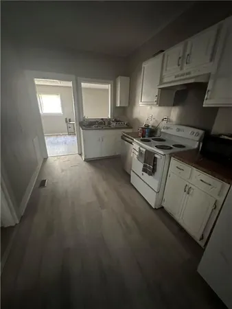 a kitchen with stainless steel appliances granite countertop a stove a sink dishwasher and a refrigerator