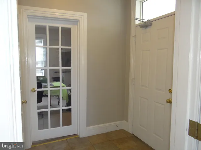 a view of empty room with windows