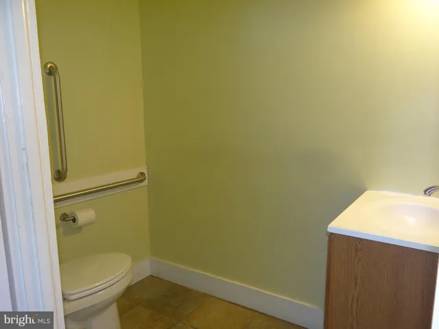 a bathroom with a toilet and a sink
