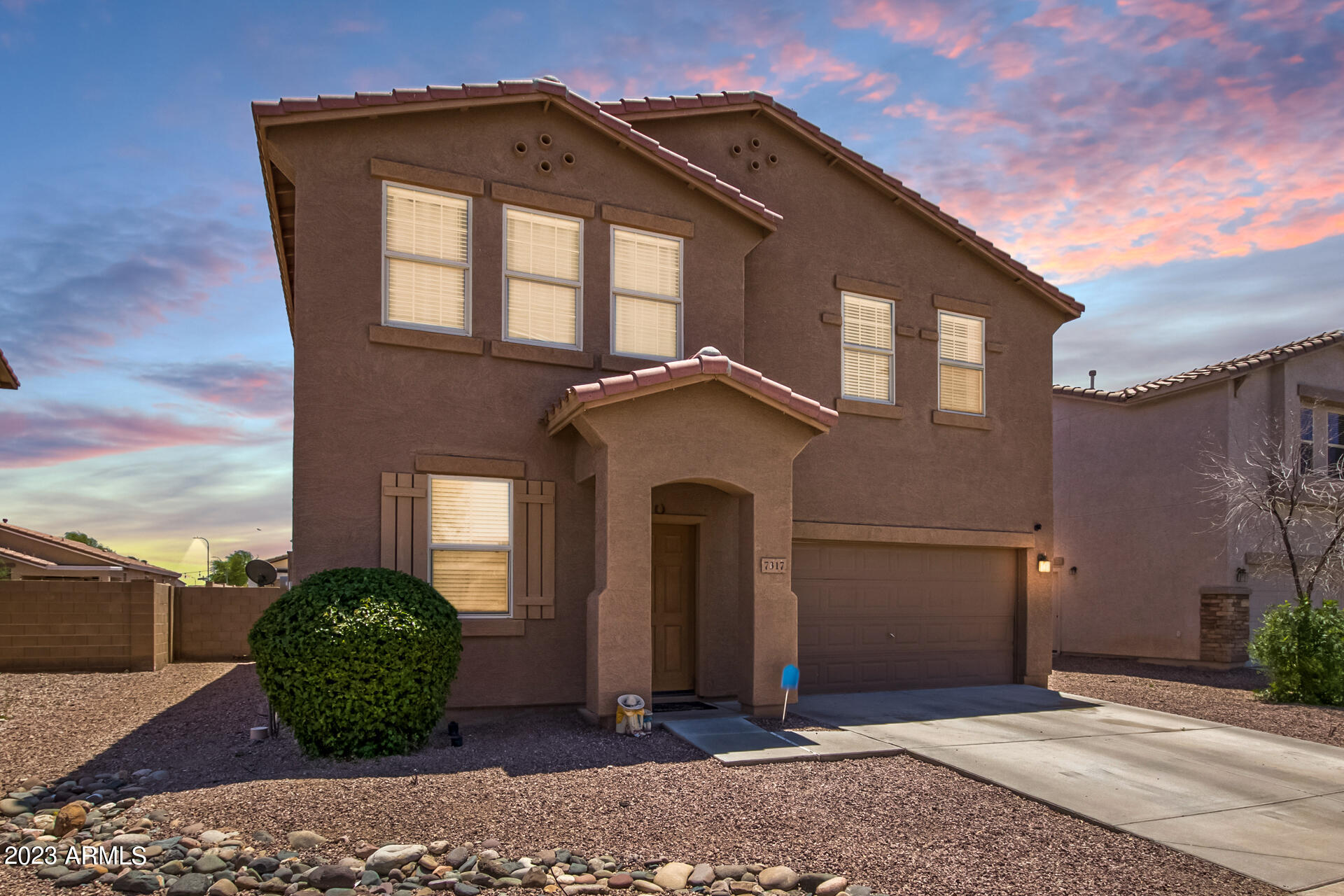 7317 West Darrel Road Laveen, AZ 85339 - Photo 1 of 13 a front view of a house