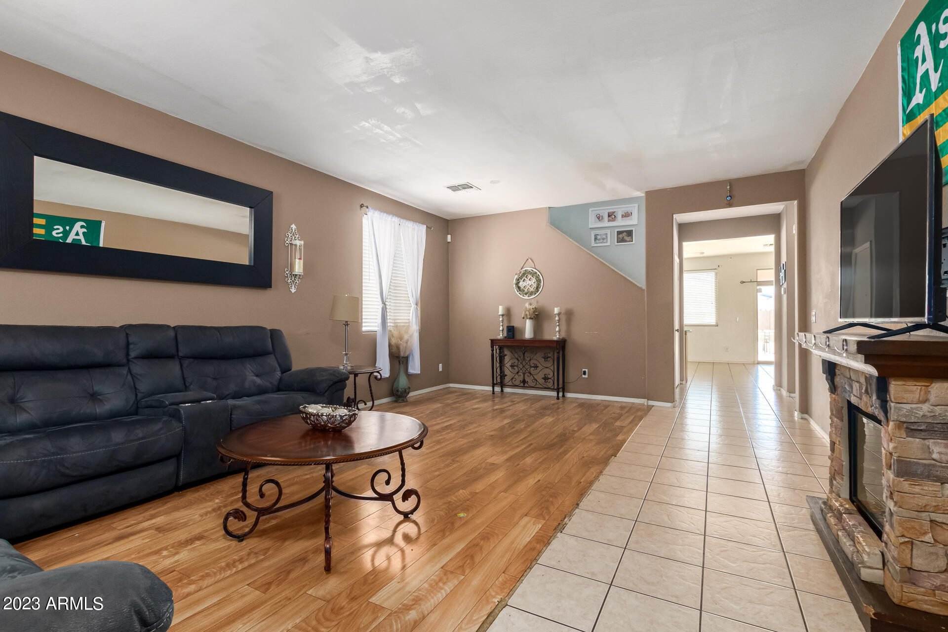 7317 West Darrel Road Laveen, AZ 85339 - Photo 3 of 13 a living room with furniture and a flat screen tv