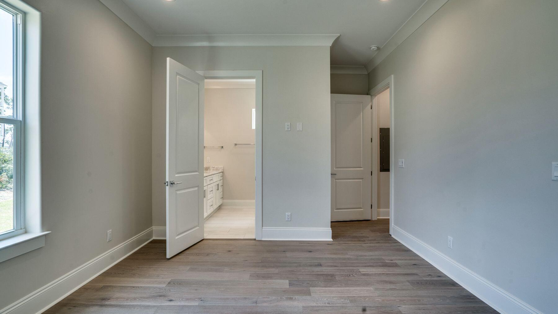 68 Sunset Key Inlet Beach, FL 32461 - Photo 13 of 29 a view of an empty room with wooden floor and a window