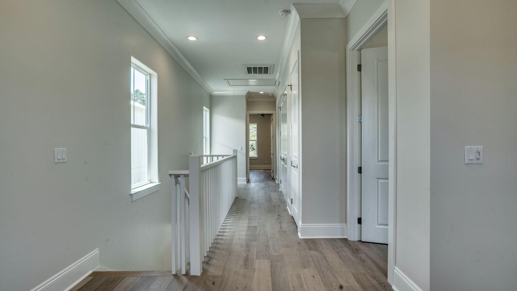 68 Sunset Key Inlet Beach, FL 32461 - Photo 16 of 29 a view of a hallway with wooden floor and staircase