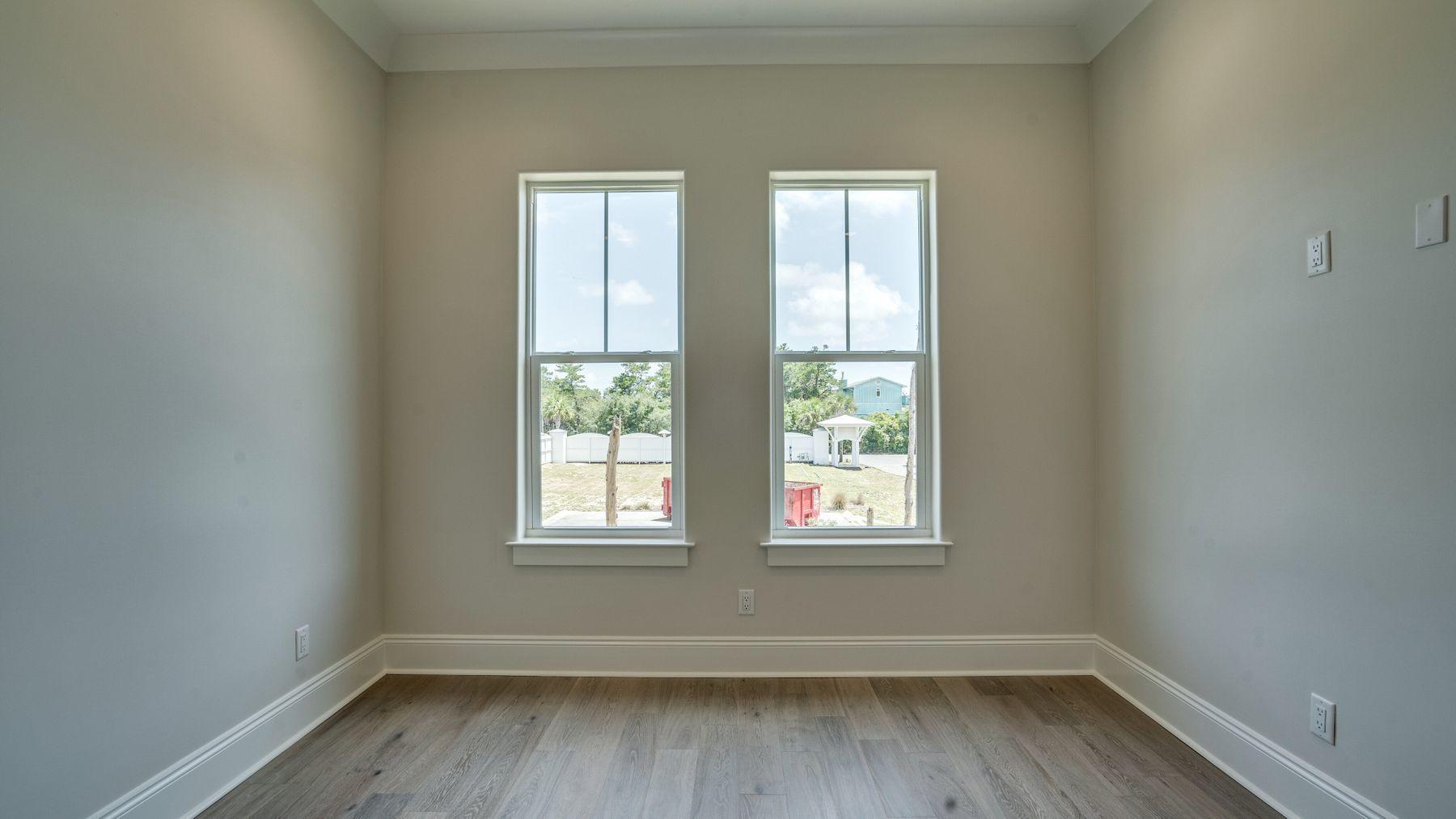 68 Sunset Key Inlet Beach, FL 32461 - Photo 20 of 29 an empty room with wooden floor and windows