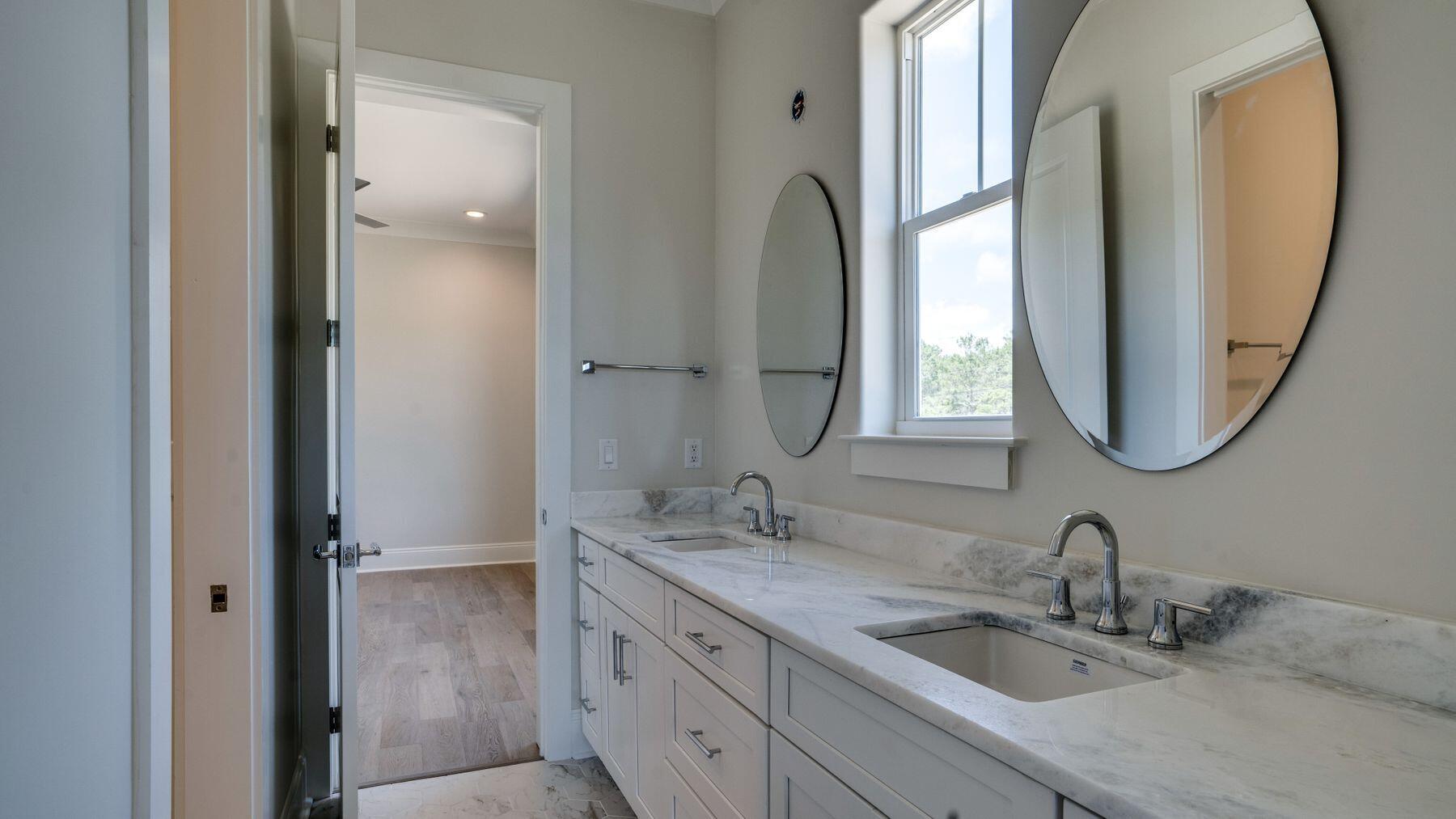 68 Sunset Key Inlet Beach, FL 32461 - Photo 21 of 29 a bathroom with a double vanity sink and a mirror