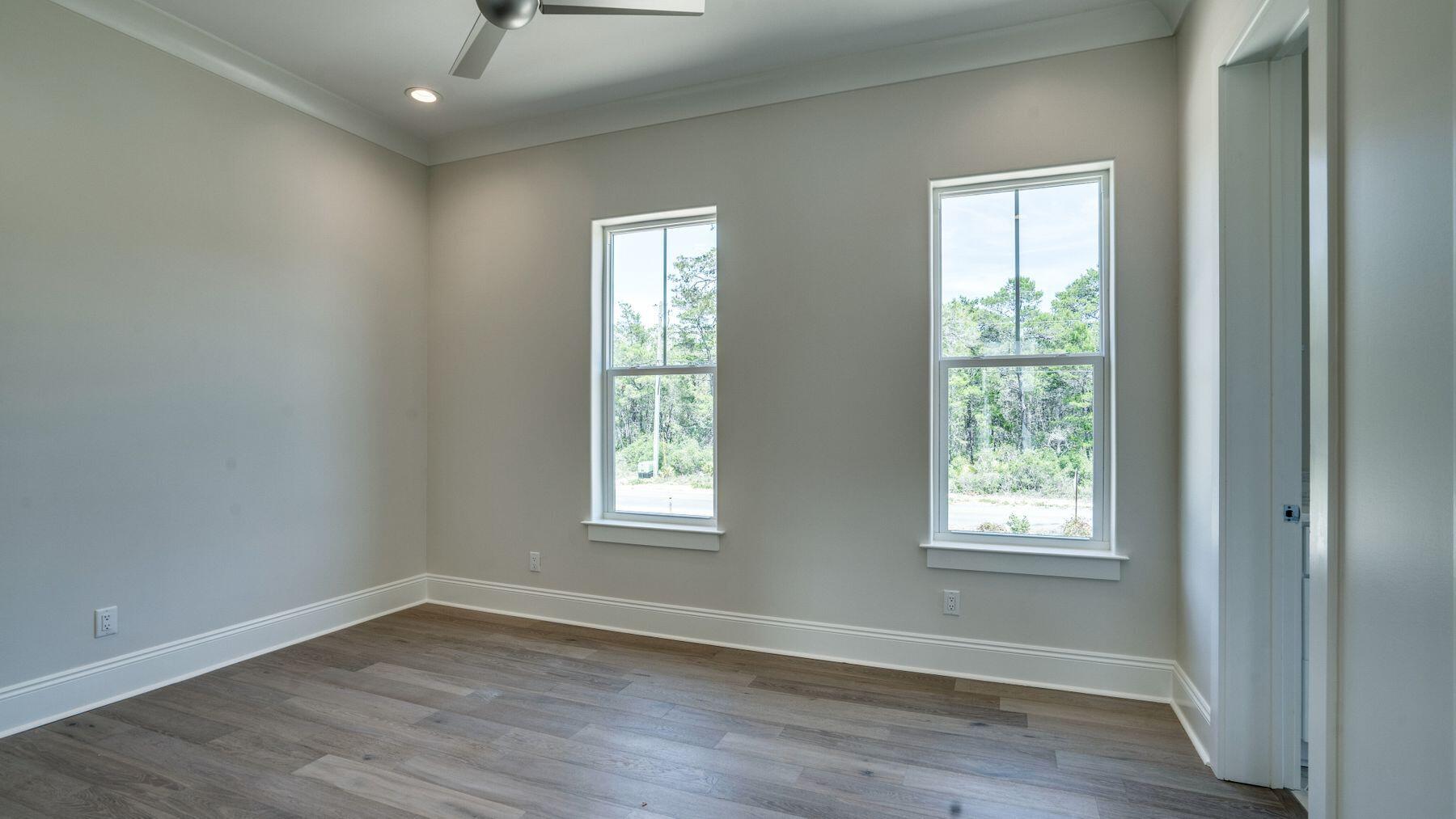 68 Sunset Key Inlet Beach, FL 32461 - Photo 22 of 29 an empty room with wooden floor and windows