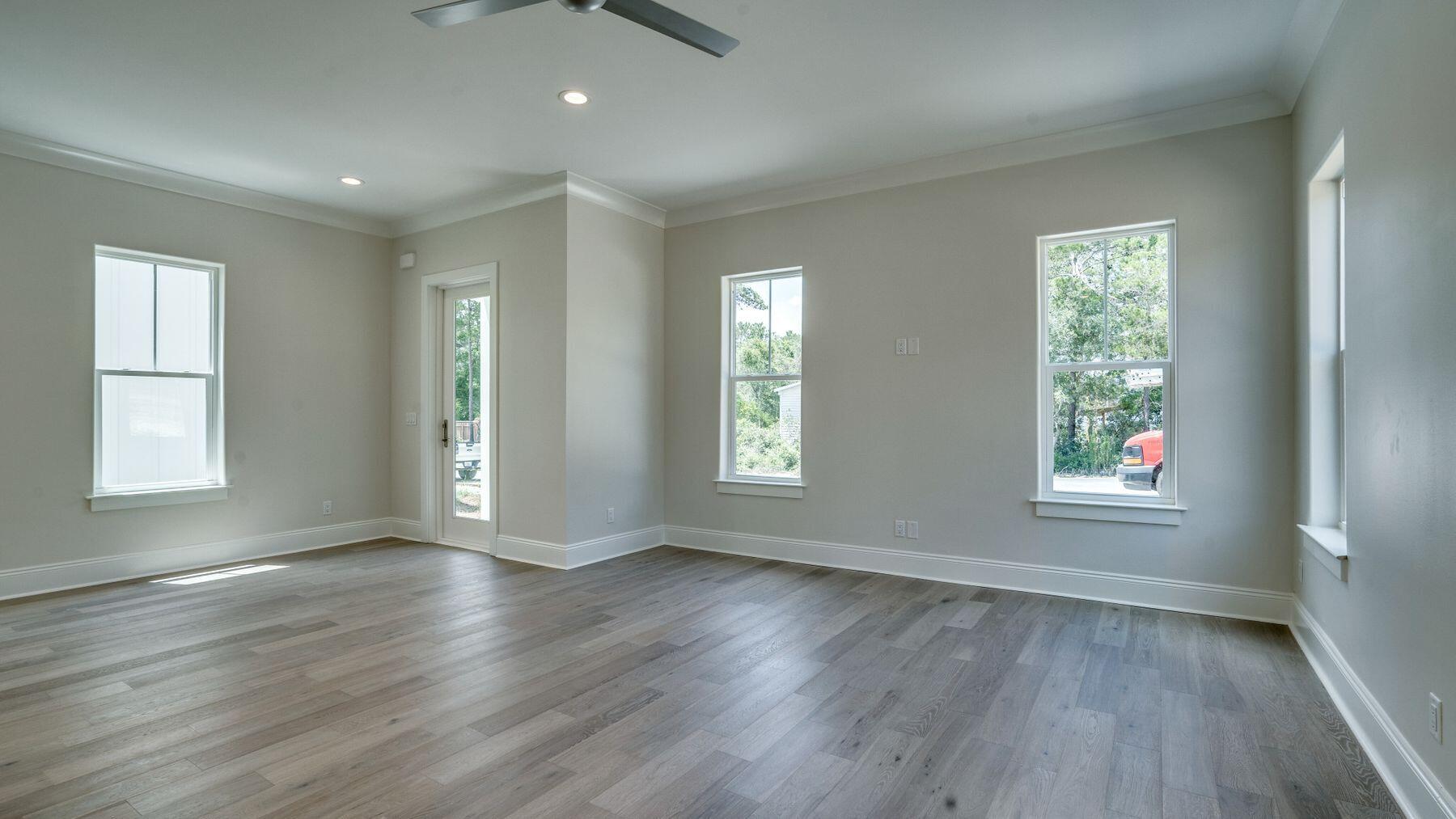68 Sunset Key Inlet Beach, FL 32461 - Photo 9 of 29 an empty room with wooden floor and windows