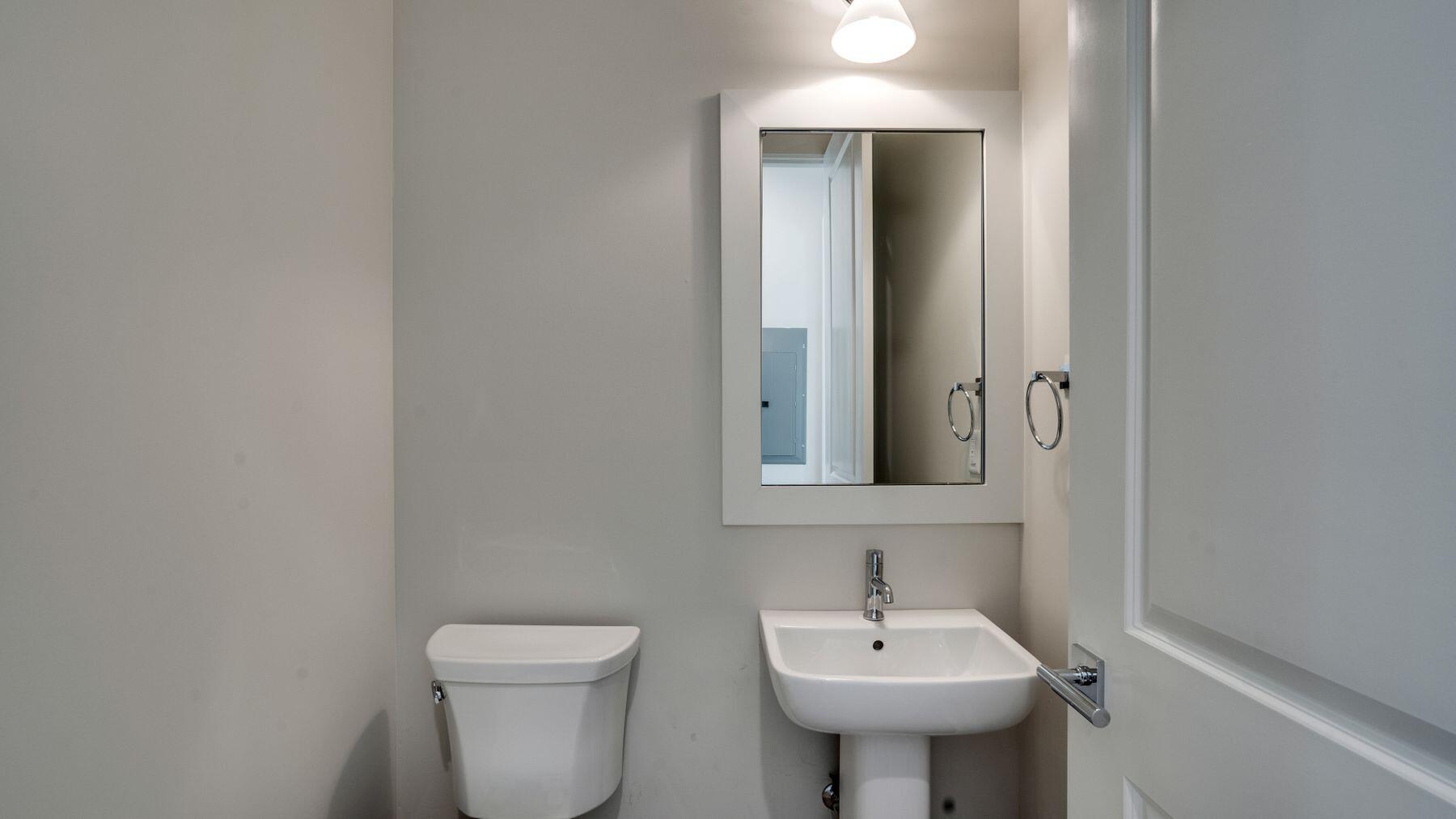 68 Sunset Key Inlet Beach, FL 32461 - Photo 10 of 29 a bathroom with a sink a toilet and mirror