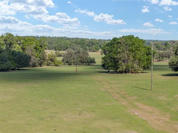 a view of a lake with a big yard