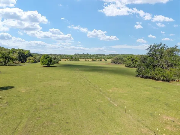 a view of an ocean and a yard