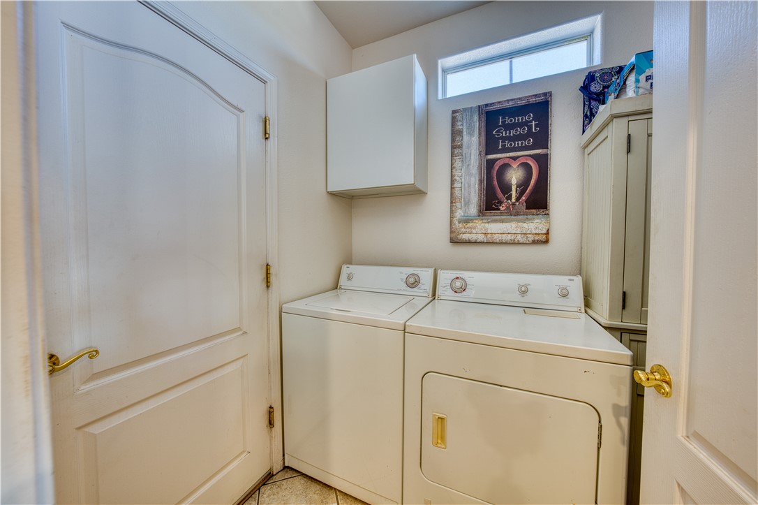2341 Half Moon Way Bullhead City, AZ 86442 - Photo 23 of 35 Laundry area featuring separate washer and dryer and cabinet space