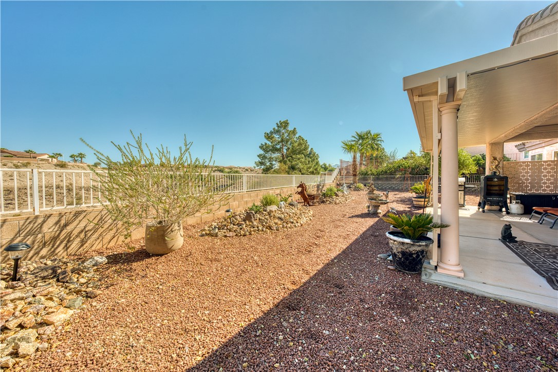2341 Half Moon Way Bullhead City, AZ 86442 - Photo 24 of 35 Fenced backyard featuring a patio area