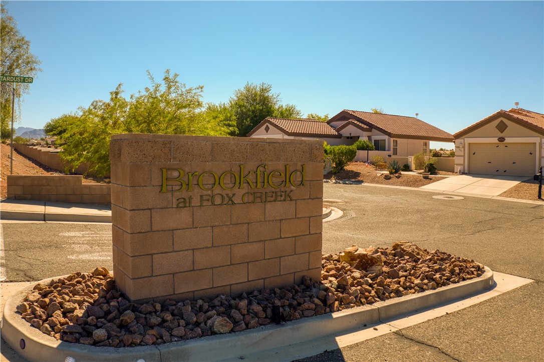 2341 Half Moon Way Bullhead City, AZ 86442 - Photo 34 of 35 Community / neighborhood sign featuring driveway and a garage