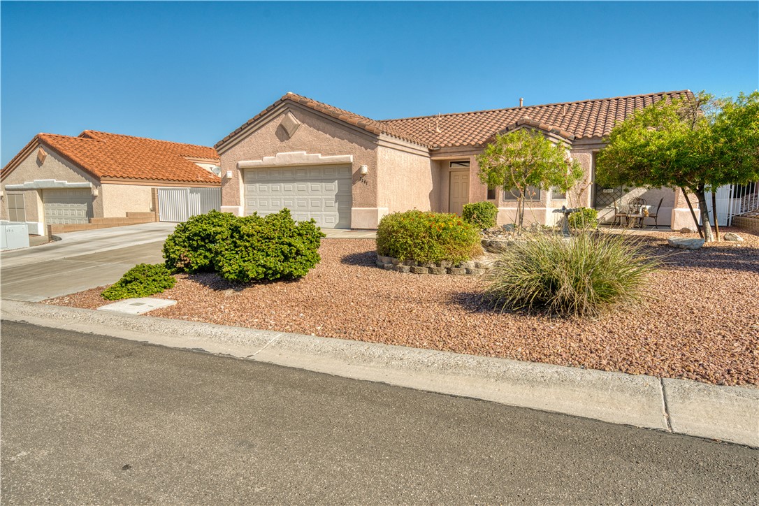 2341 Half Moon Way Bullhead City, AZ 86442 - Photo 35 of 35 Mediterranean / spanish-style home with a tile roof, stucco siding, a garage, and concrete driveway