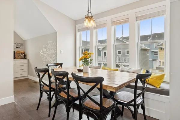 a view of a dining room with furniture and a window