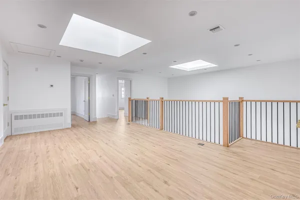 a view of a livingroom with wooden floor