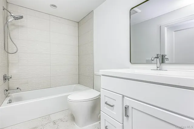 a bathroom with a sink a toilet and a bathtub