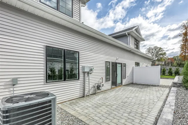 a view of a house with a yard and garage