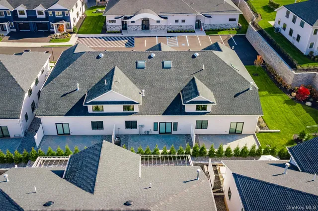 an aerial view of a houses with street view