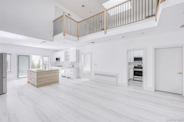 a view of kitchen with cabinets and wooden floor