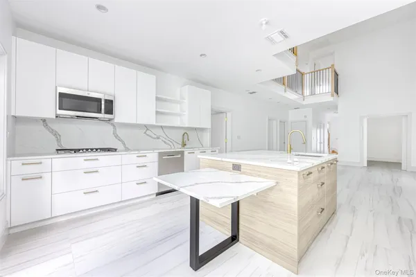 a kitchen with a stove a sink and a refrigerator