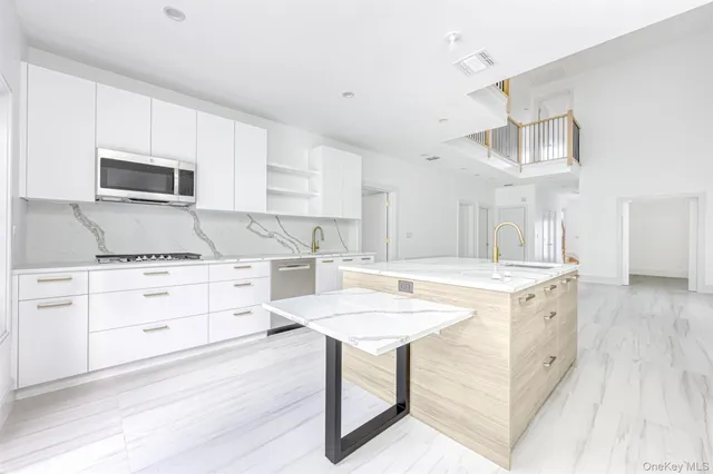 a kitchen with a stove a sink and a refrigerator