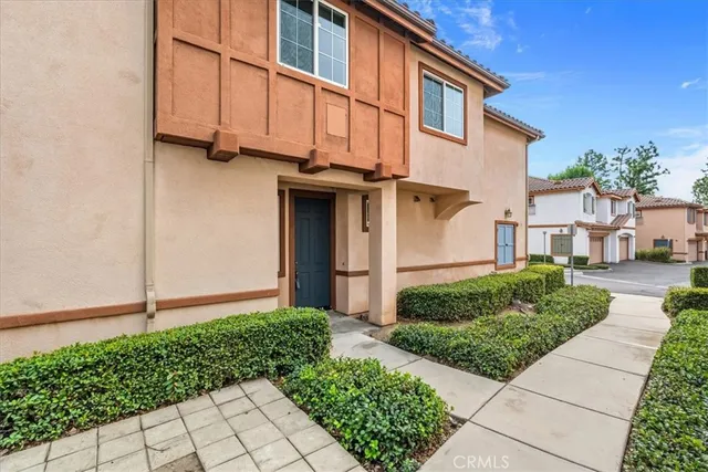 a view of a house with a small yard