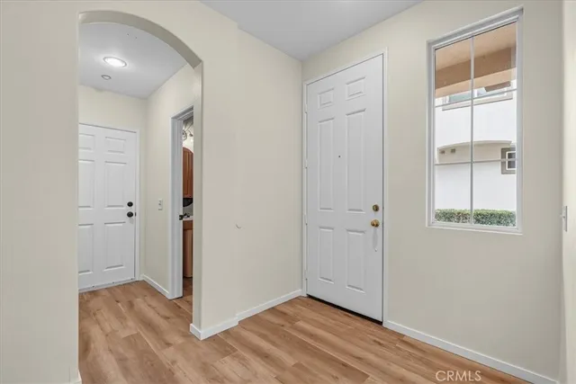 a view of entryway with wooden floor