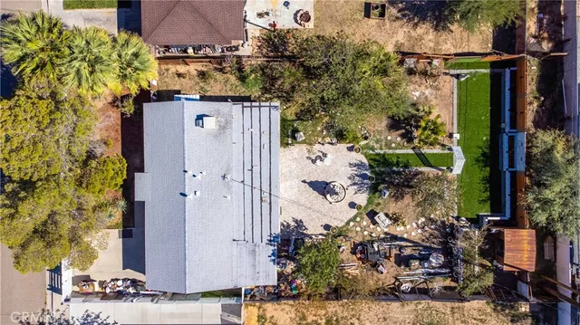 front view of a house with a tree