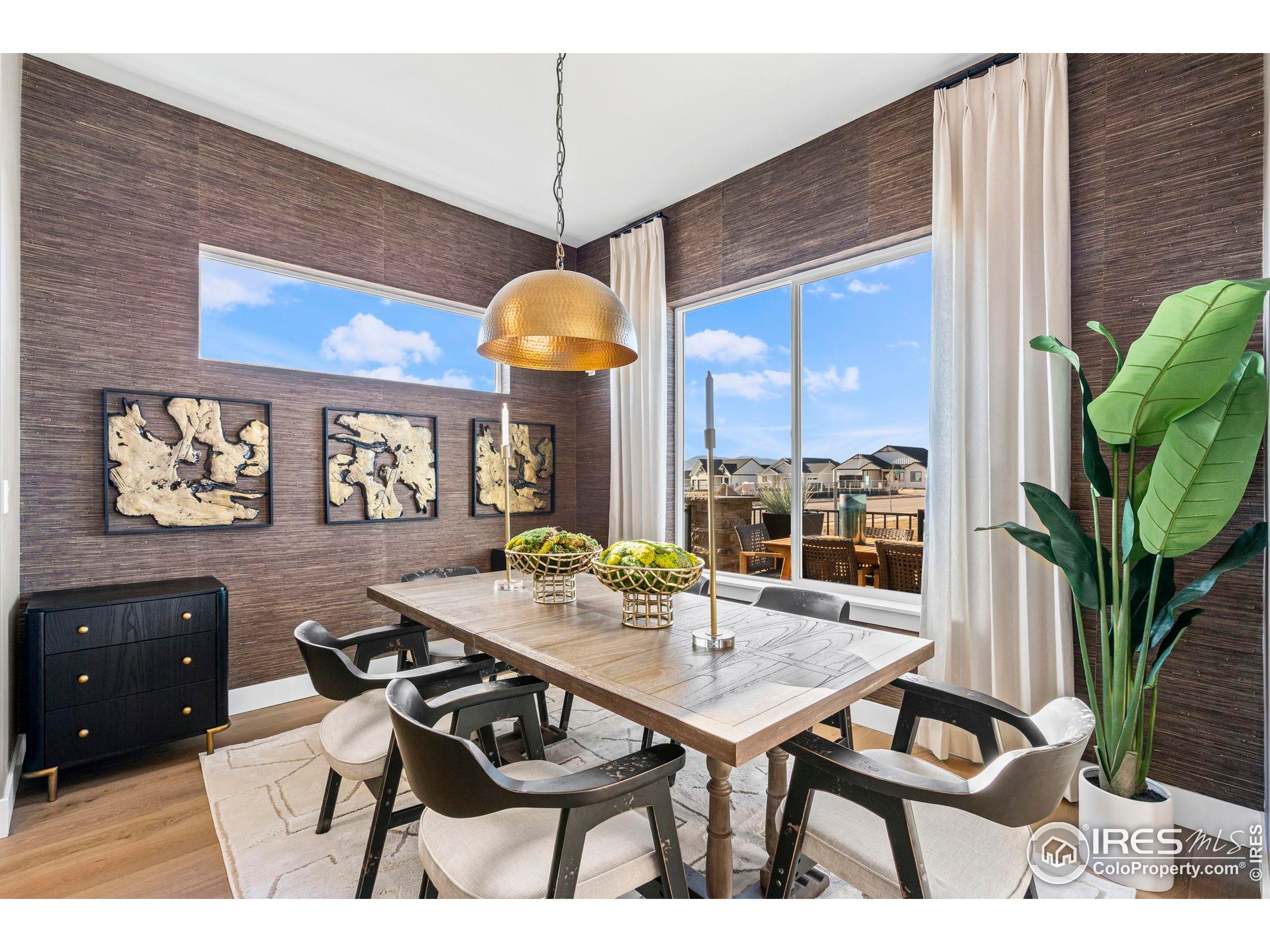 3016 Windward Way Fort Collins, CO 80524 - Photo 16 of 49 a view of a dining room with furniture and window