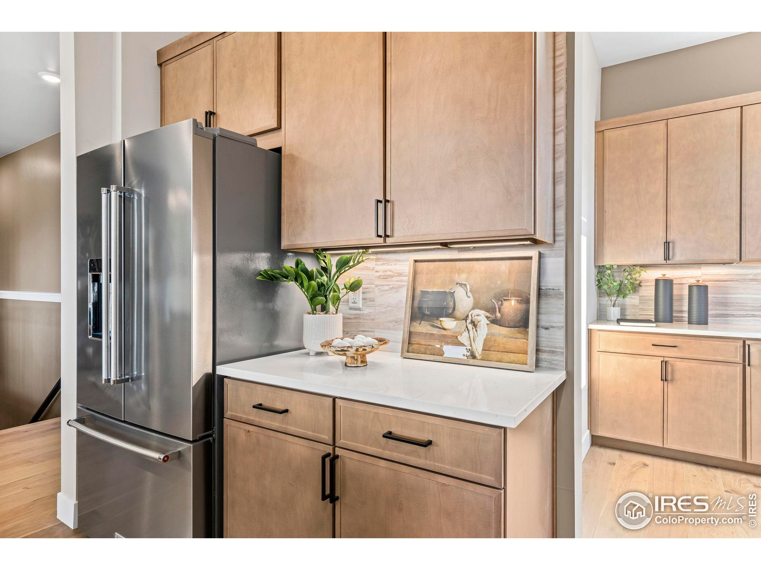 3016 Windward Way Fort Collins, CO 80524 - Photo 19 of 49 a kitchen with stainless steel appliances granite countertop a refrigerator and a sink