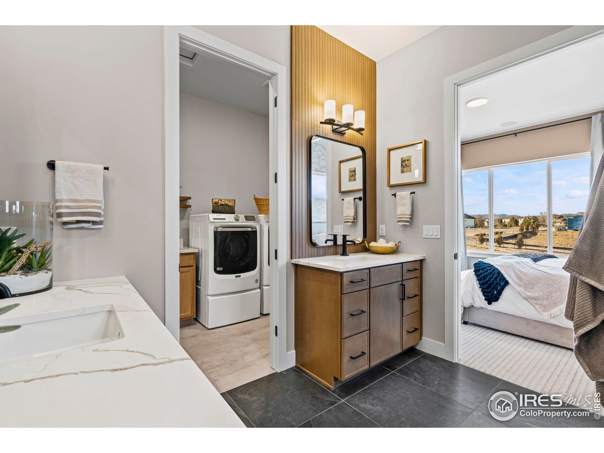 3016 Windward Way Fort Collins, CO 80524 - Photo 27 of 49 a kitchen with a refrigerator and white cabinets