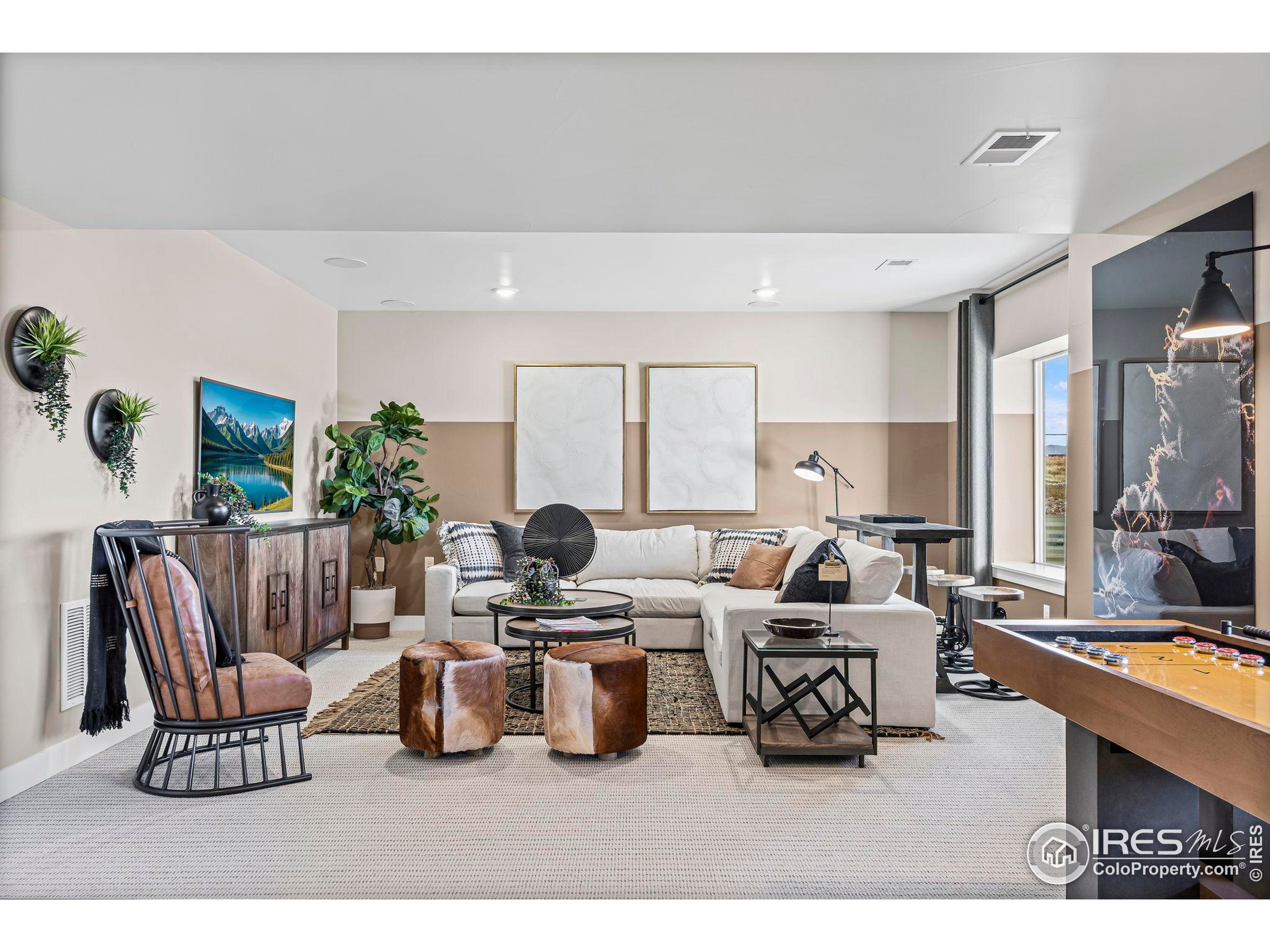 3016 Windward Way Fort Collins, CO 80524 - Photo 32 of 49 a living room with furniture and a large window
