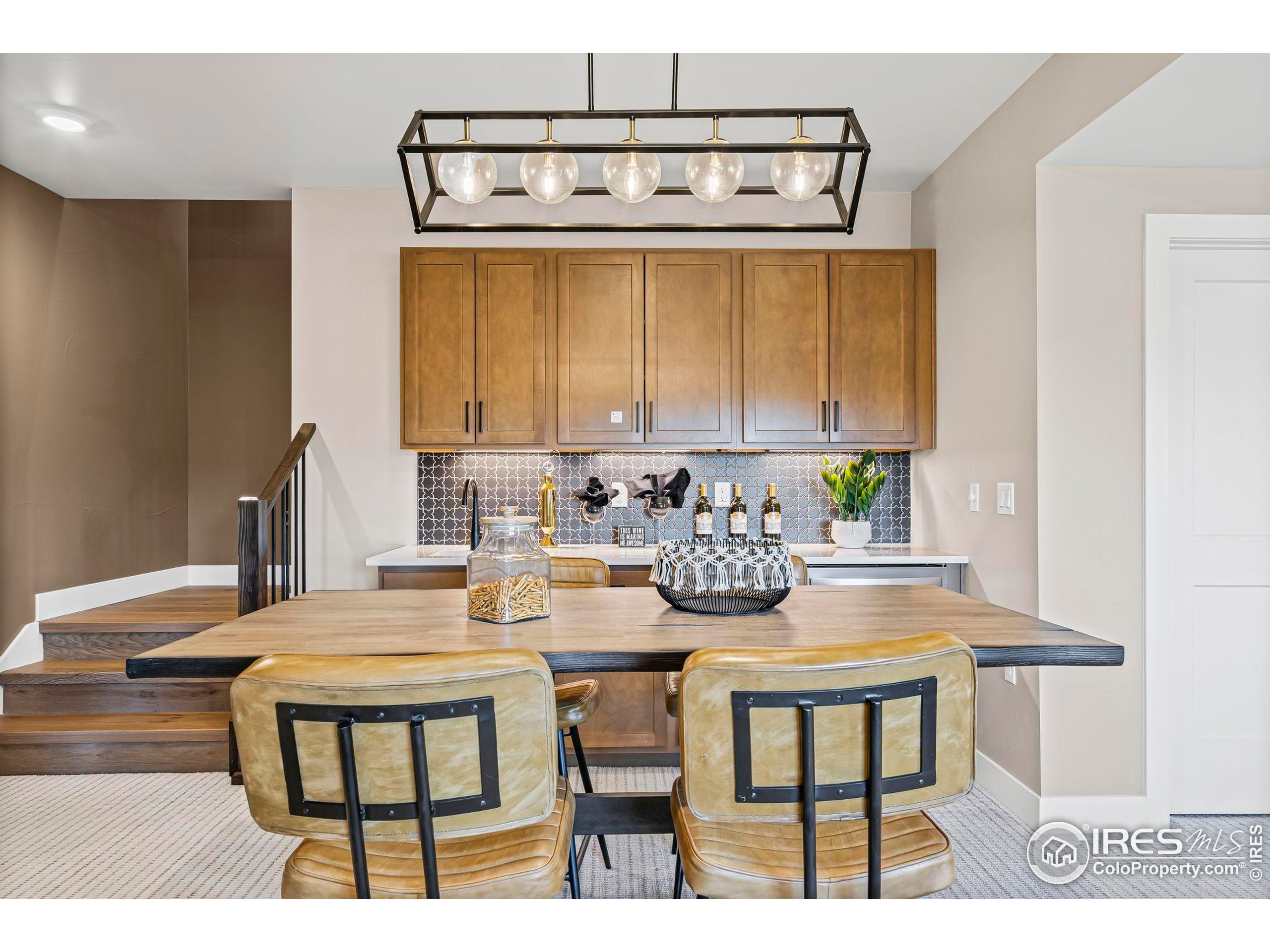3016 Windward Way Fort Collins, CO 80524 - Photo 33 of 49 a view of a dining room with furniture and a window