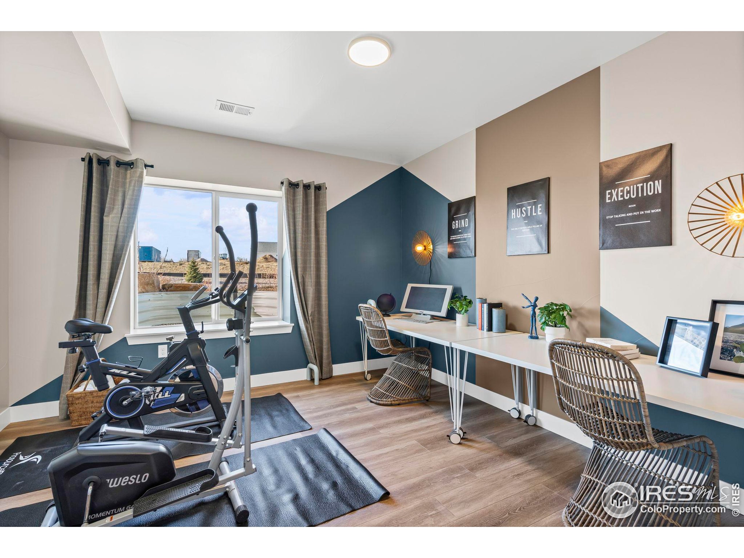 3016 Windward Way Fort Collins, CO 80524 - Photo 38 of 49 a living room with furniture and a flat screen tv