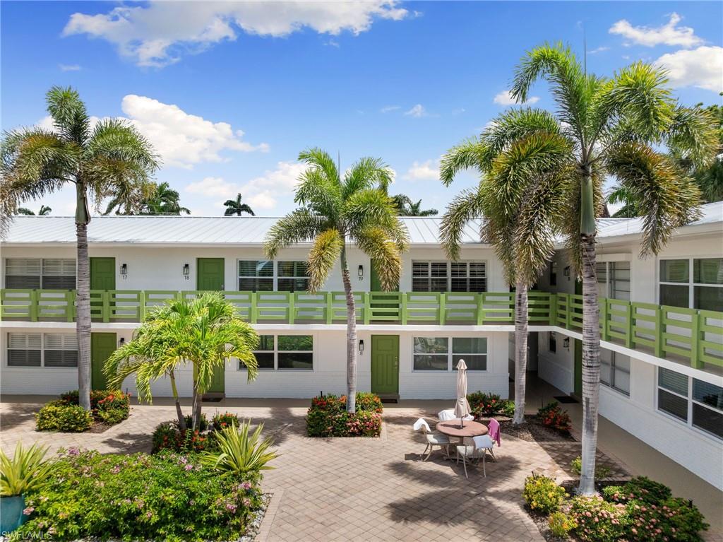 975 9th Avenue South, Unit 19 Naples, FL 34102 - Photo 1 of 19 a view of a house with patio outdoor seating