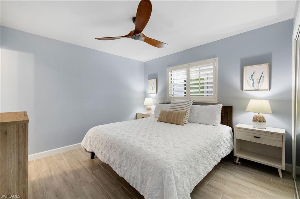975 9th Avenue South, Unit 19 Naples, FL 34102 - Photo 11 of 19 a bedroom with a bed and window